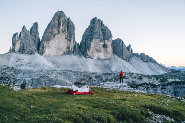 istock Male hiker camps out on mountain ridge crest 1284092801