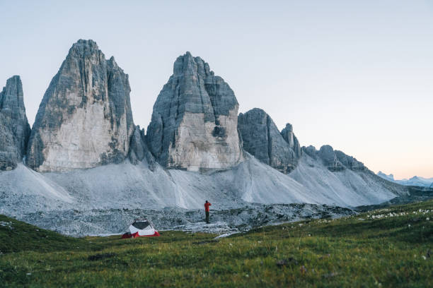 istock Male hiker camps out on mountain ridge crest 1284092803