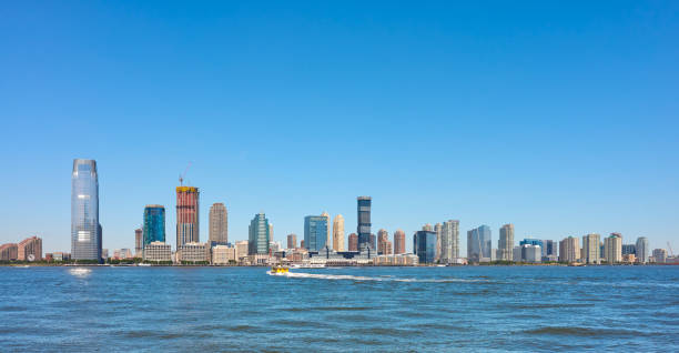 istock Jersey City skyline on a sunny summer day, USA. 1284092884