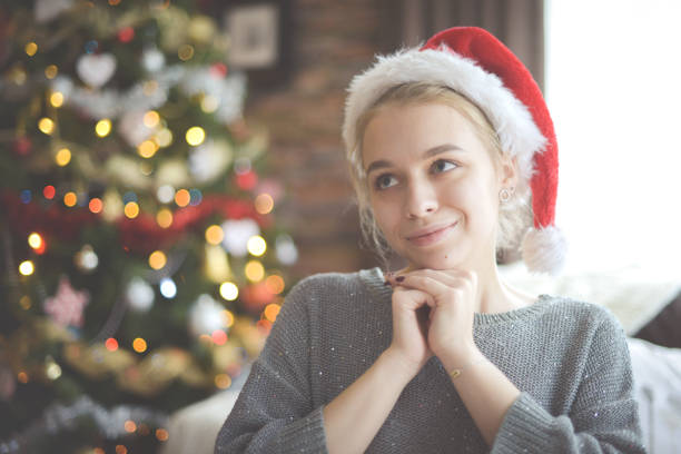 istock young woman in christmas interior 1284094293