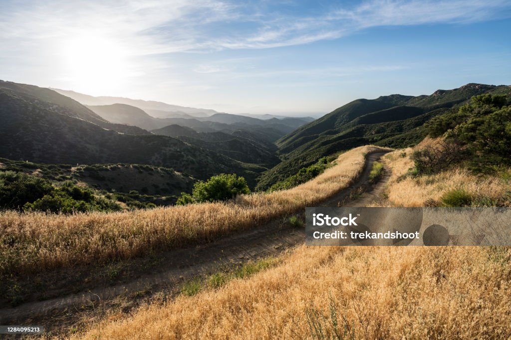 Rocky Peak Road near Los Angeles California Santa Susana Mountains canyon view from fire road in Rocky Peak nature park near Los Angeles and Simi Valley in scenic Southern California. Dirt Road Stock Photo