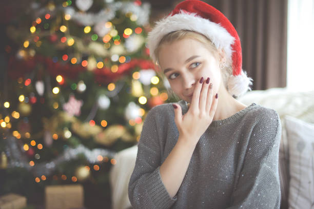 istock young woman in christmas interior 1284096327