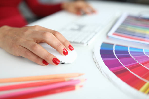 istock Female hands with manicure works at the computer 1284096660