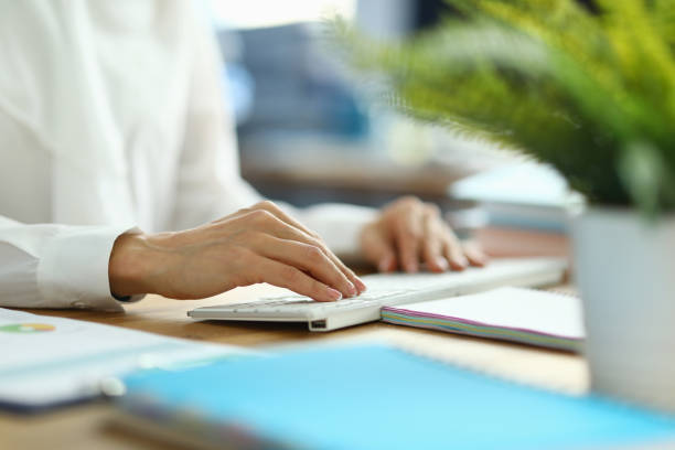 istock Female financier working on keyboard close up 1284096699