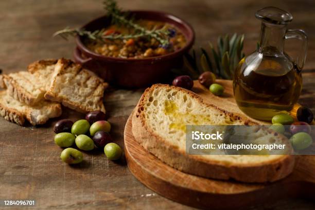 Composition With Extra Virgin Olive Oil On Homemade Bread Stock Photo - Download Image Now