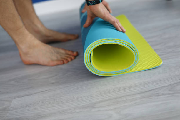 istock A man twists on a laminate a rubber mat close-up 1284096705