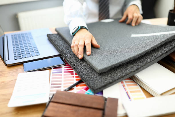 istock A man shows samples of flooring to repair a room 1284096710
