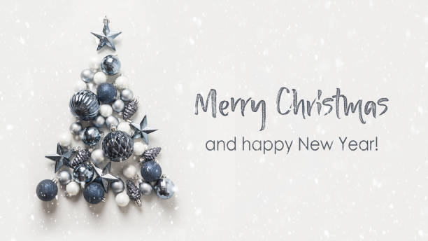Christmas tree made of blue balls on grey background. Happy New Year. Christmas tree made of blue balls on grey background. Flat lay, top view. Holiday greeting card with text - Merry Christmas. coupon photos stock pictures, royalty-free photos & images