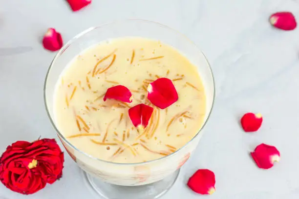 Tradtional Indian Festive Sweet Dish Garnished with Rose Petals Close-Up Horizontal Photo