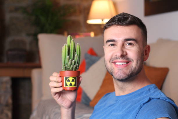 istock Man showing anti radiation plant 1284097954