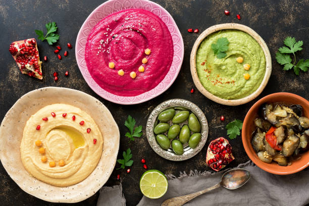 istock Assorted Middle Eastern hummus. Colored hummus. Arab food. Top view, flat lay. 1284099845
