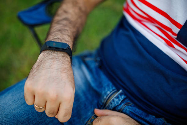 istock Young man using smart watch measuring heart rate 1284100061