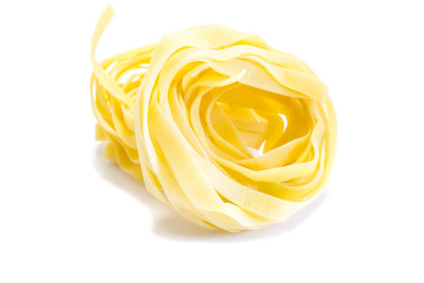 istock dried tagliatelle isolated on white background 1284100719