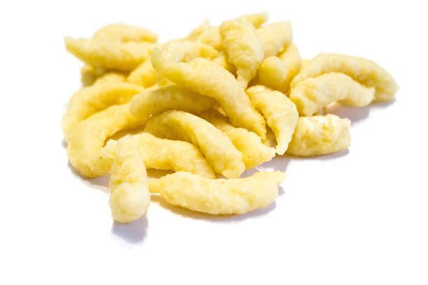 istock pile of spaetzle isolated on white background 1284100736