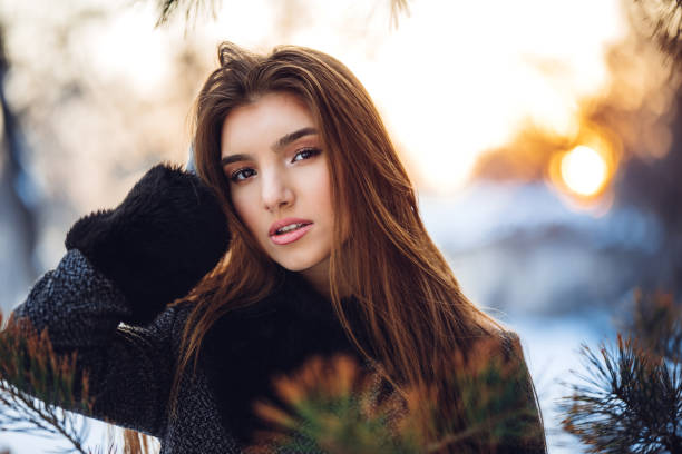 Young Caucasian beautiful woman outdoors on snowy day.