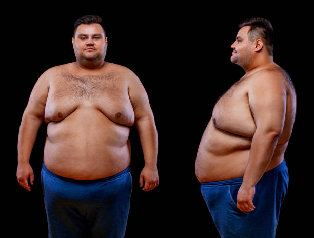Two views of young shirtless fat man: front and profile shot, isolated on black background Two views of young fat man: front and profile shot, isolated on black background. fat guy no shirt stock pictures, royalty-free photos & images