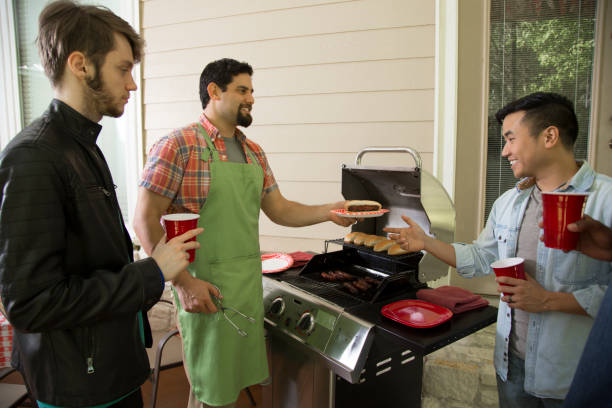 istock Multi ethnic group of young men at a cook out. 1284102152