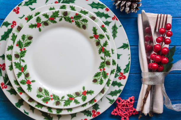 istock Top view of Christmas Table Setting on blue wooden table 1284102154