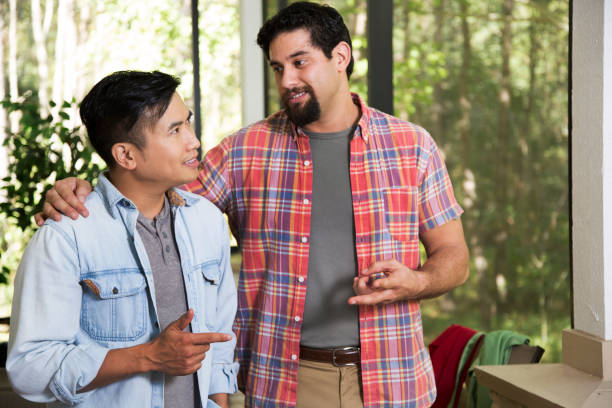 istock Multi ethnic group of young men at a cook out. 1284102311