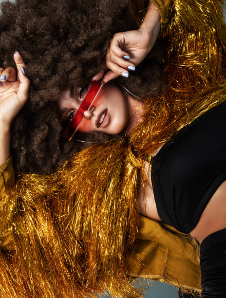 istock Afro, curly haired woman lying on the floor. 1284103591