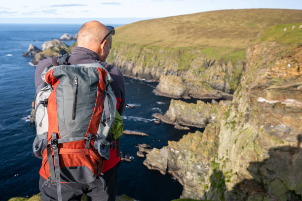 istock Male hiker photographing cliffs 1284104404