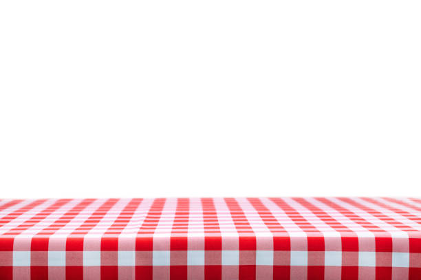 Classic italian cuisine style template Italian cooking template - blank table with a red checked tablecloth on a white background with copy space. picnic table stock pictures, royalty-free photos & images