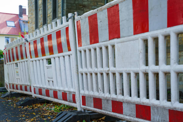 istock Red and white mobile signal fence. 1284107433