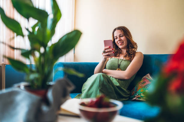 istock Woman relaxing with smartphone 1284108798