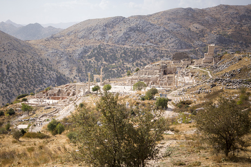 Madaba, Jordan - March 19, 2014: People on the street near the archaeological park. Madaba is widely known due to the ancient mosaic map and the mosaic school