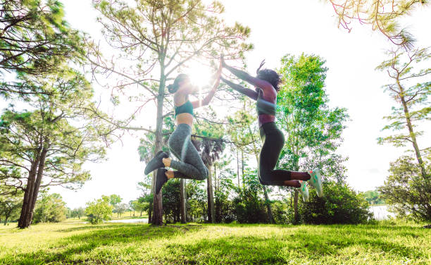 istock Two women celebrate completing a hard workout with a high five 1284111467