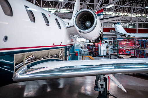 The usual maintenance of the private airplane in the hangar before the flight.