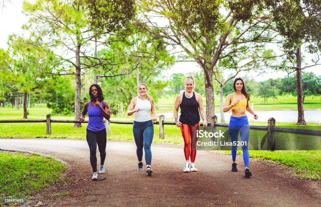 Group of women power walking outdoors Group of athletic women walking outdoors Racewalking Stock Photo