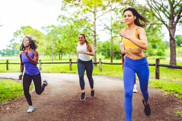 istock Group of female athletes sprinting in a friendly race 1284111773