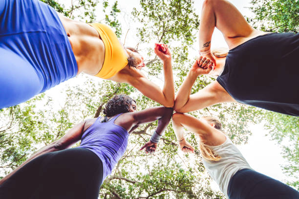 istock Group of women do a group elbow bump for a covid high five after a workout 1284111806