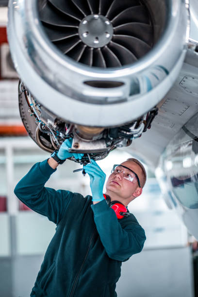 istock Young airplane mechanic works on a private jet 1284111904