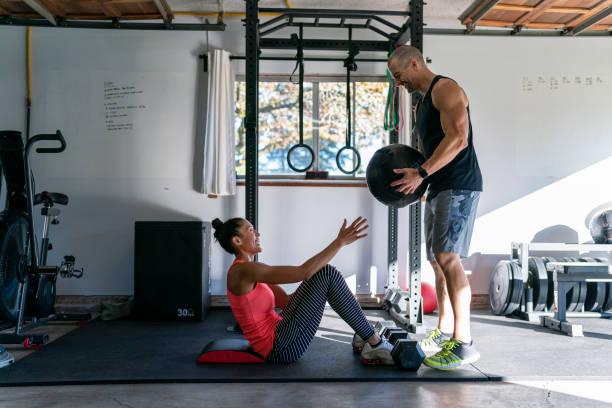 istock Husband and wife doing workout at home 1284114129