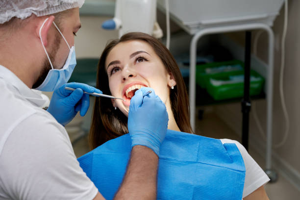 istock Woman having teeth check up at dentist office 1284114946
