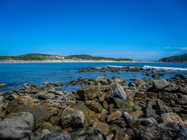 istock Blue water beaches and rocks in the foreground 1284115001