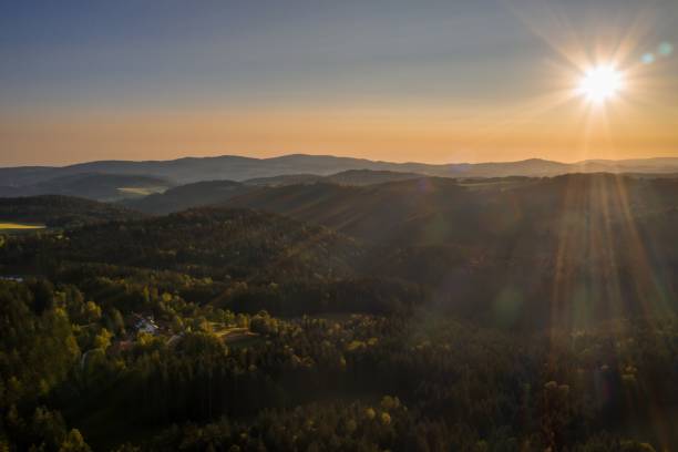 Picture of an aerial view in the Bavarian forest with landscape and mountains in the background during sunset, Germany Picture of an aerial view in the Bavarian forest with landscape and mountains in the background during sunset, Germany bavarian forest stock pictures, royalty-free photos & images