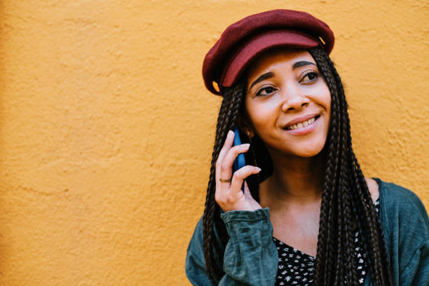 istock black woman with braids making phone call with smartphone 1284115500
