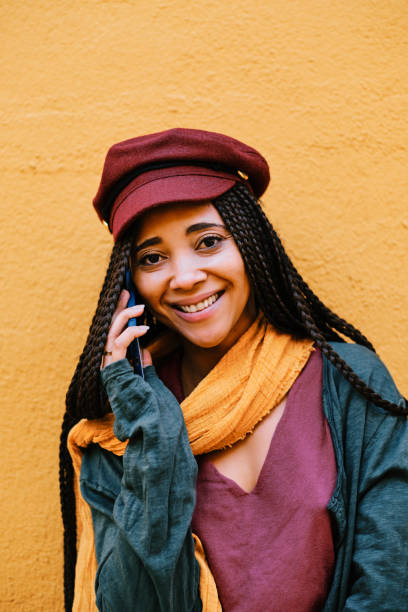 istock black woman with braids making phone call with smartphone 1284115533