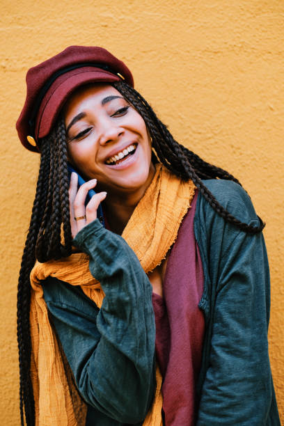istock black woman with braids making phone call with smartphone 1284115539