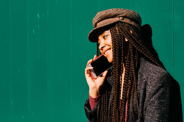 istock black woman with braids making phone call with smartphone 1284116273