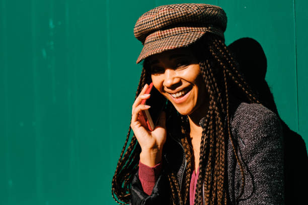istock black woman with braids making phone call with smartphone 1284116287