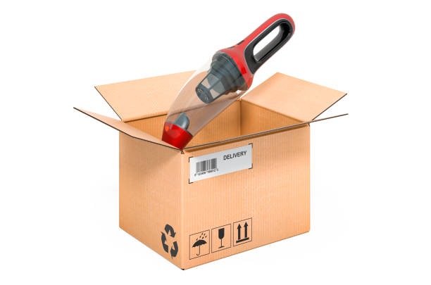 istock Portable vacuum cleaner inside cardboard box, delivery concept. 3D rendering isolated on white background 1284116684