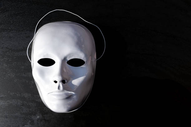 istock White theatrical mask on the black background 1284117782