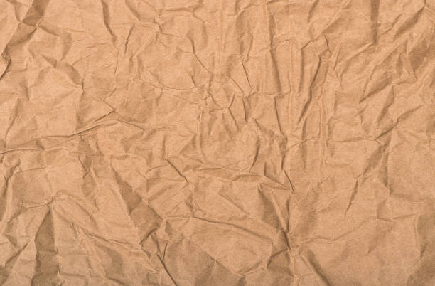 istock Recycled crumpled paper texture Craft background 1284120113