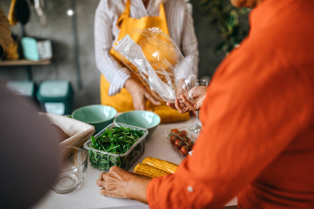 istock Senior friends unpacking raw vegetable 1284121200