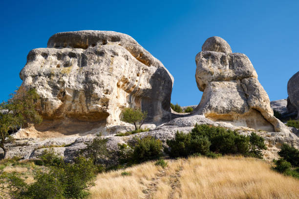 istock Sunny rocky mountain scene, yellow dry grass, blue sky, Crimea 1284122255