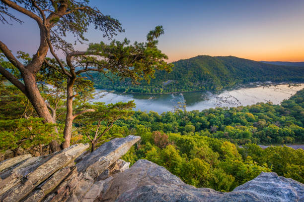Sunset view of the Potomac River, from Weverton Cliffs, near Harpers Ferry, West Virginia Sunset view of the Potomac River, from Weverton Cliffs, near Harpers Ferry, West Virginia appalachia stock pictures, royalty-free photos & images